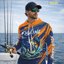 Load image into Gallery viewer, Angler wearing Custom Marlin Fishing Blue Orange long sleeve hooded saltwater fishing jersey 