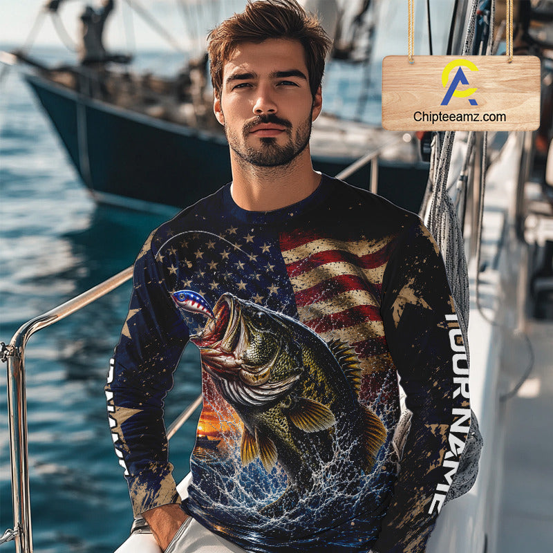 Man on a boat wearing a American flag bass fishing shirt long sleeve, sitting on the boat