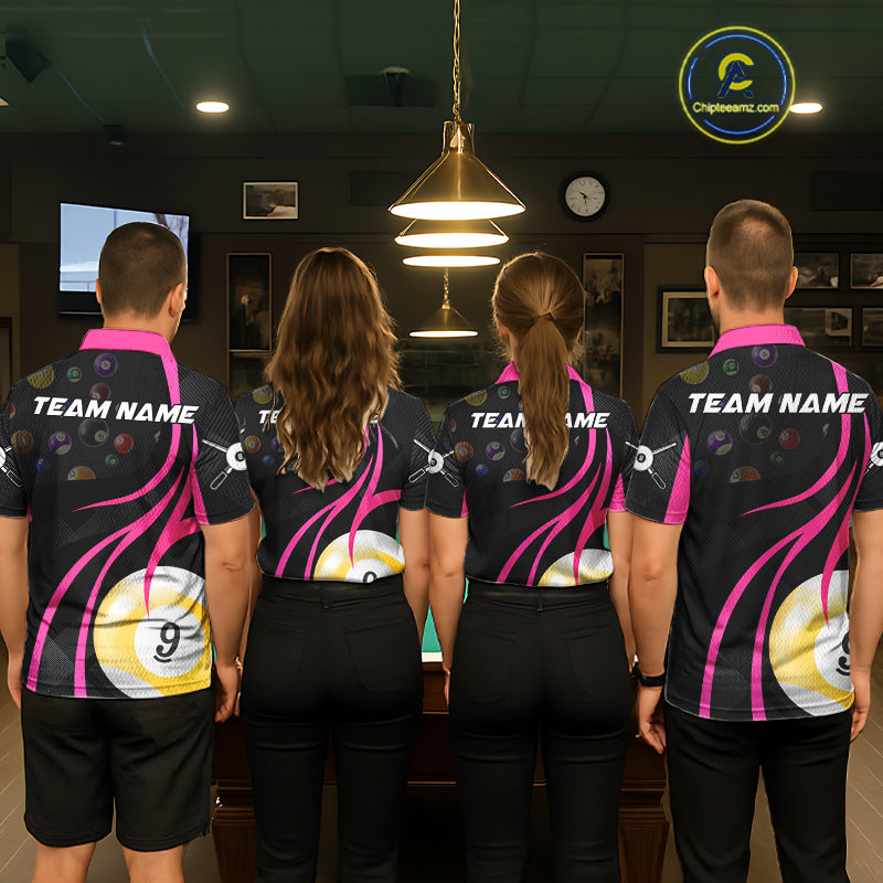 Back view of pool players wearing matching pink billiard shirts in a game room.