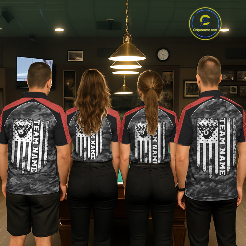 Back view of pool players wearing matching grey camo billiard shirts in a game room.