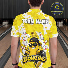 Load image into Gallery viewer, Back view of man wearing a funny yellow banana bowling polo shirt inside a bowling alley.