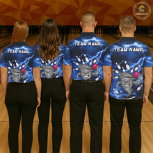 Load image into Gallery viewer, Back view of bowling team wearing matching blue tornado bowling shirts in a bowling alley.