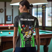 Load image into Gallery viewer, Back view of woman wearing a black and green 8 ball and 9 ball pool shirt in a billiards hall.