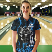 Load image into Gallery viewer, Woman wearing a blue flaming panther bowling polo shirt at a bowling alley front view.