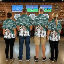 Load image into Gallery viewer, Back view of darts players wearing matching green marble swirl darts shirts.