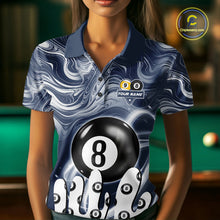 Load image into Gallery viewer, Woman wearing a blue marble swirl 8 ball and 9 ball billiard jersey beside a pool table front view.
