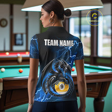 Load image into Gallery viewer, Back view of woman wearing a blue thunder lightning dragon 9 ball pool shirt in a billiards hall.