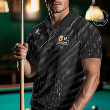 Load image into Gallery viewer, Man wearing a black polo shirt with pool ball design and text, holding a pool cue in a billiards setting.