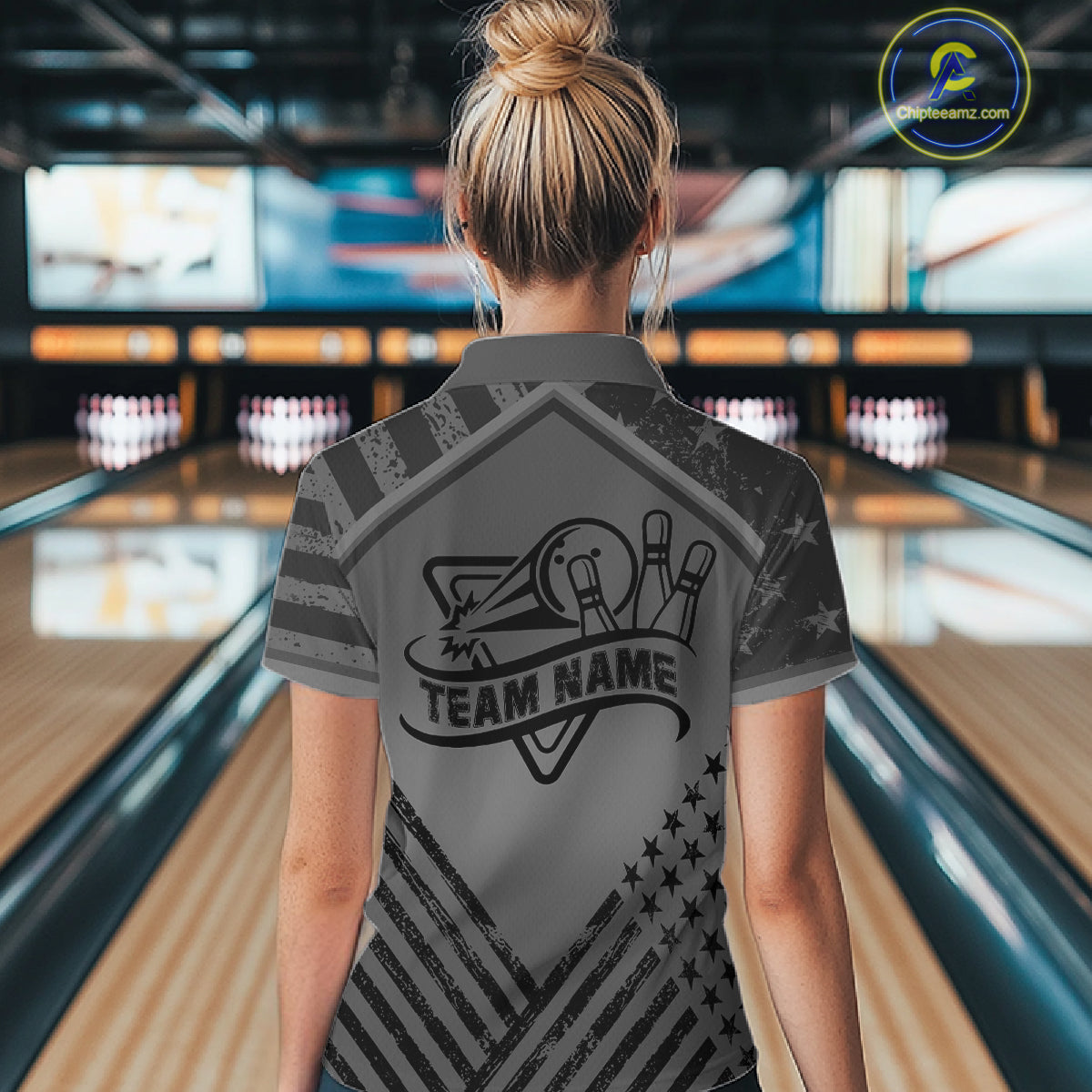 Woman wearing a grey American flag bowling quarter zip jersey during league play front view.