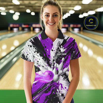 Woman wearing a purple splatter bowling polo shirt at a bowling alley front view.