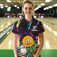 Load image into Gallery viewer, Woman wearing a colorful sunflower bowling polo shirt at a bowling alley front view.