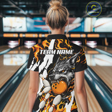 Load image into Gallery viewer, Woman wearing personalized orange flame wolf bowling team jersey quarter zip shirt featuring orange flame wolf artwork, front view.