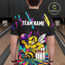 Load image into Gallery viewer, Person wearing a black bowling shirt with colorful design and bee graphic in a bowling alley.