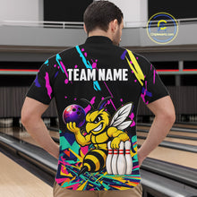 Load image into Gallery viewer, Person wearing a colorful bowling-themed shirt with a bee design in a bowling alley.