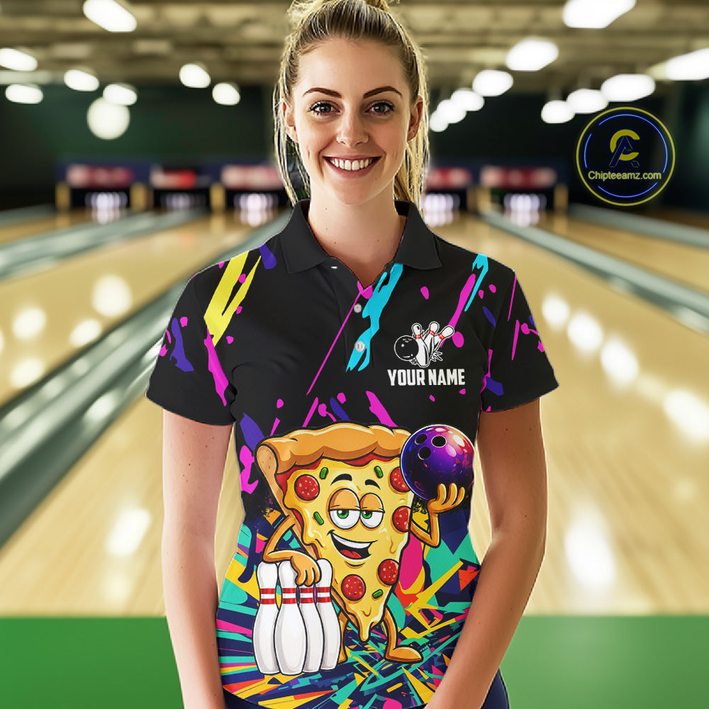 Woman wearing a colorful bowling-themed shirt with a pizza graphic in a bowling alley.