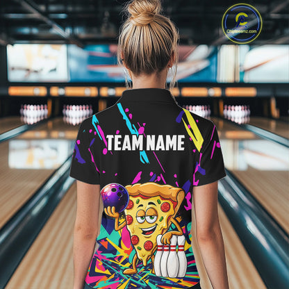 Person wearing a colorful bowling-themed shirt with a pizza design in a bowling alley.