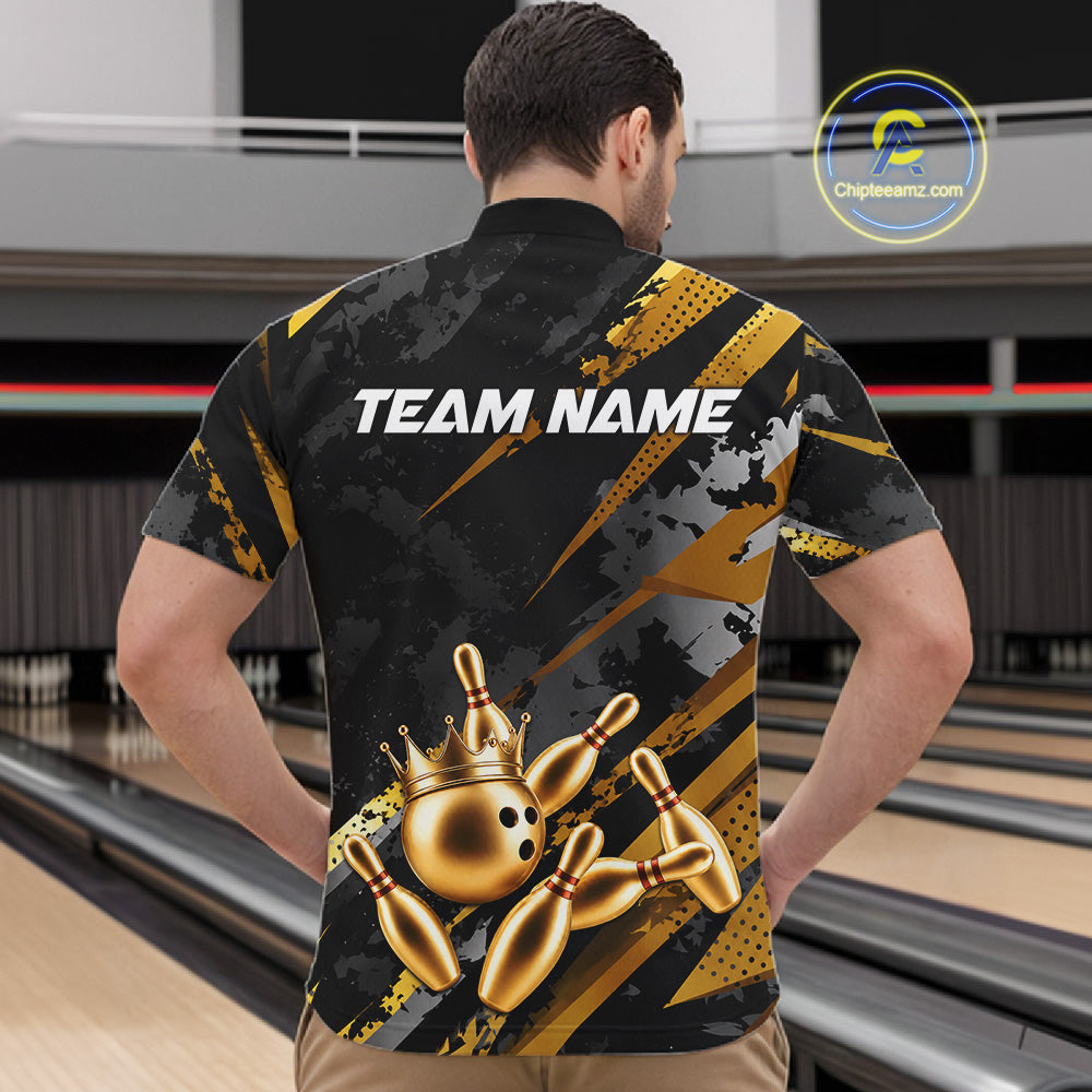 Man wearing a black and gold bowling shirt with 'TEAM NAME' on the back in a bowling alley.