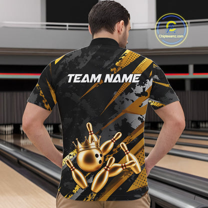 Man wearing a black and gold bowling shirt with 'TEAM NAME' on the back in a bowling alley.