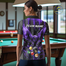 Load image into Gallery viewer, Back view of woman wearing a purple lightning eagle pool team shirt in a billiards hall.