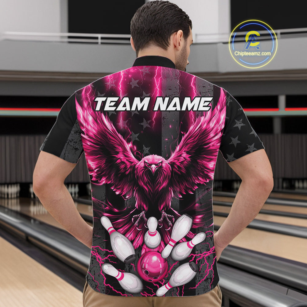 Back view of man wearing a pink lightning eagle bowling quarter zip shirt in a bowling alley.