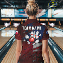 Load image into Gallery viewer, Back view of woman wearing a retro Texas flag bowling polo shirt inside a bowling alley.