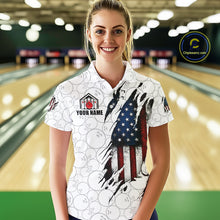 Load image into Gallery viewer, Woman wearing a vintage American flag white bowling polo shirt at a bowling alley front view.