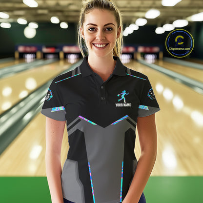 Woman wearing a holographic bowling polo shirt at a bowling alley front view.