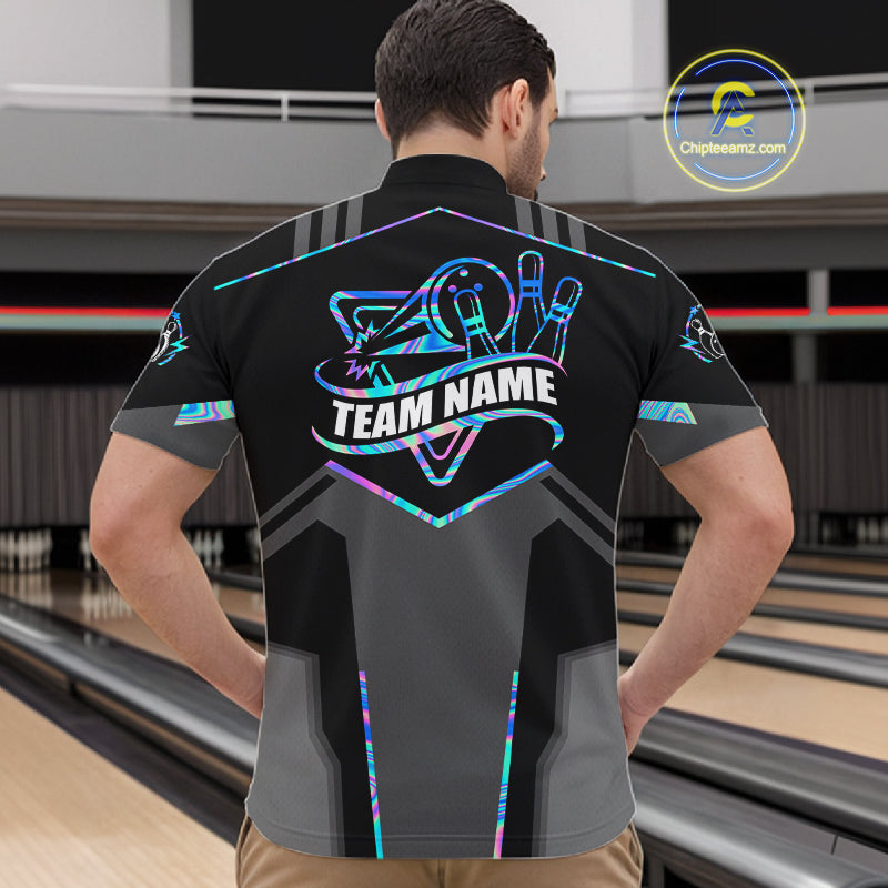 Back view of man wearing a holographic bowling quarter zip shirt in a bowling alley.