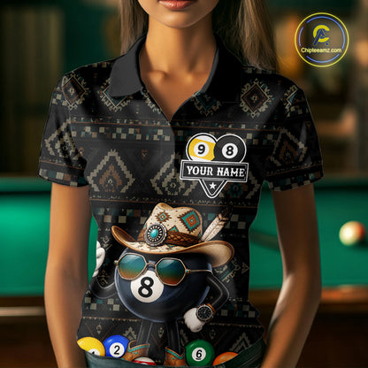 Woman wearing an 8 ball and 9 ball tribal pattern billiard jersey beside a pool table front view.