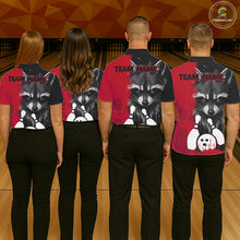 Load image into Gallery viewer, Back view of bowling team wearing matching black and red raccoon bowling shirts in a bowling alley.