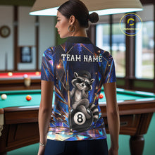 Load image into Gallery viewer, Back view of woman wearing a funny raccoon crystal 8 ball pool shirt in a billiards hall.