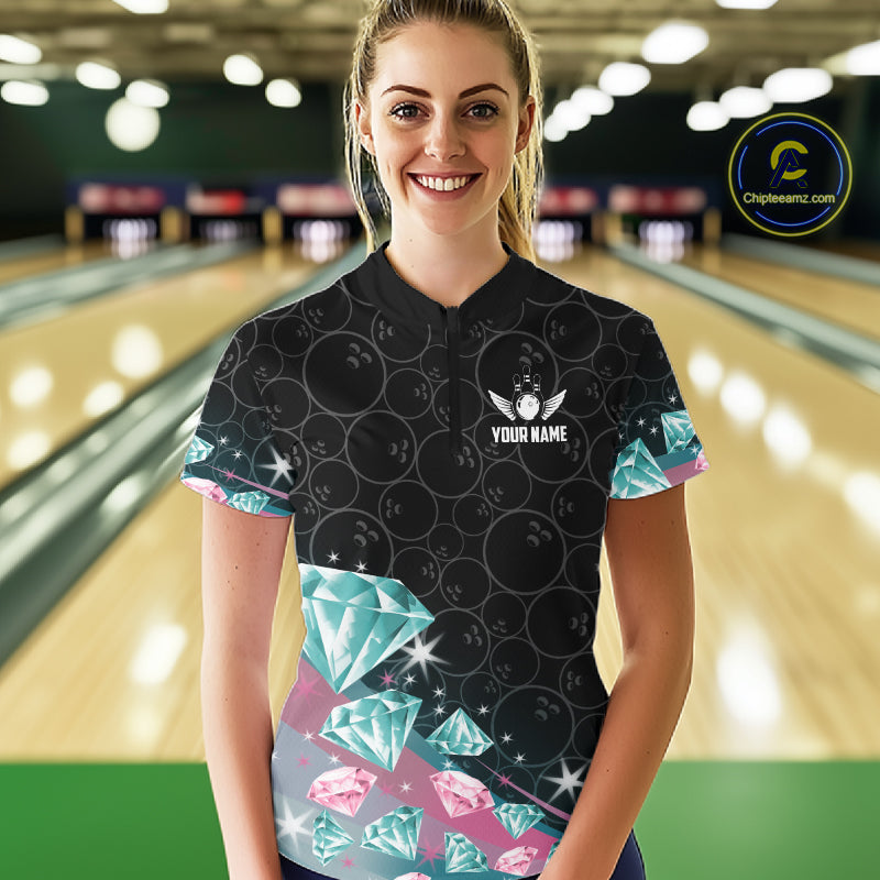 Woman wearing a black bowling shirt with diamonds patterns in a bowling alley.