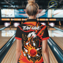 Load image into Gallery viewer, Woman wearing black and orange flame eagle bowling polo shirt back view.