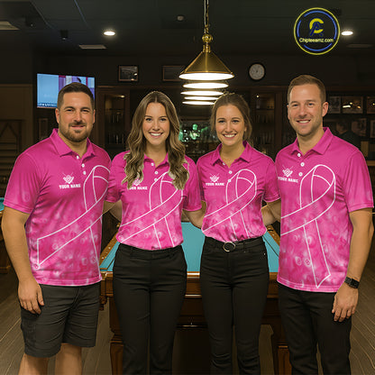 Pool team wearing matching pink ribbon billiard jerseys during awareness tournament front view.
