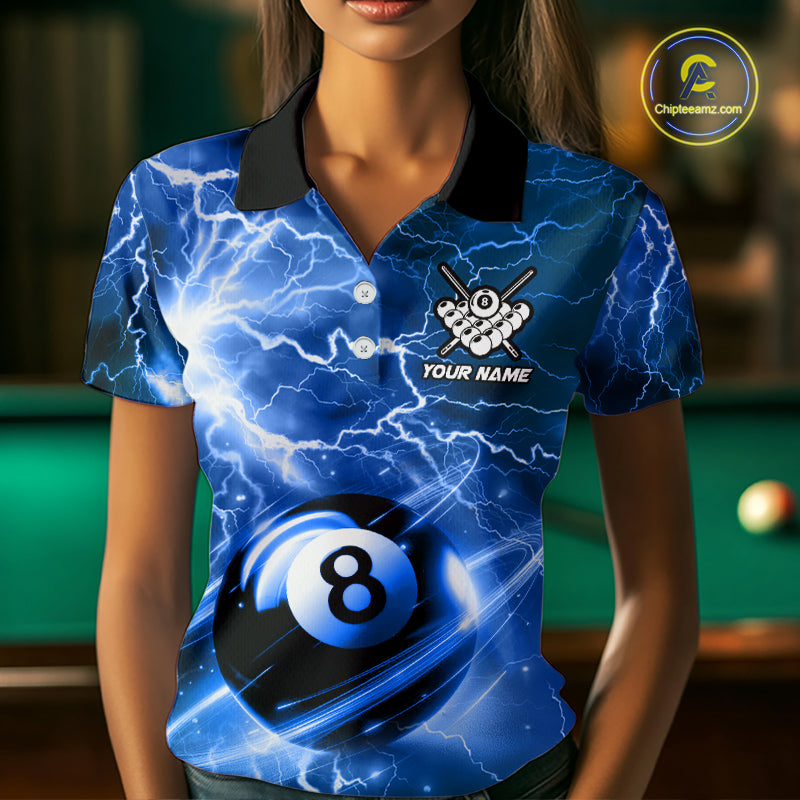 Woman wearing a blue 8 ball thunder lightning billiard jersey beside a pool table front view.