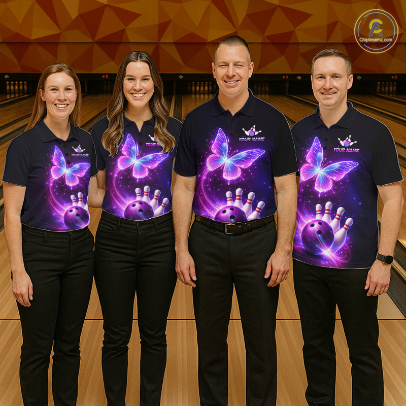 Four people wearing matching shirts with a butterfly design on a bowling alley.
