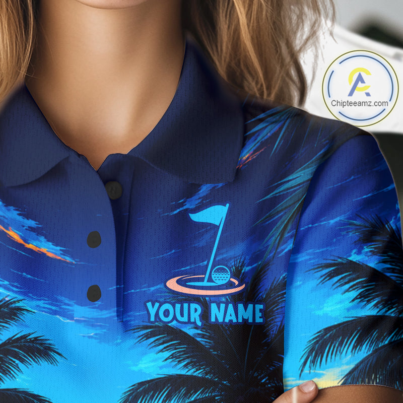 Woman wearing tropical sunset palm tree golf polo shirt during golf outing