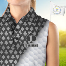 Load image into Gallery viewer, Person wearing a sleeveless shirt with card suit pattern and golf club design, with a blurred background.