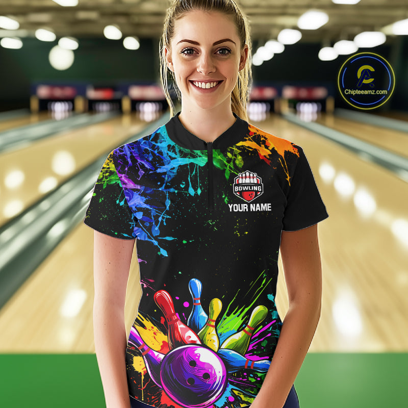 Female bowler wearing Colorful Rainbow Splatter bowling jersey, custom women's bowling shirt