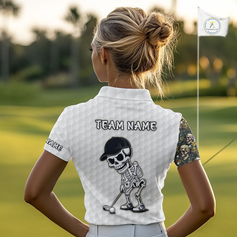 Female golfer wearing tropical skull golf polo on sunny golf course, fashionable golf apparel representing freedom, nature and resort living.
