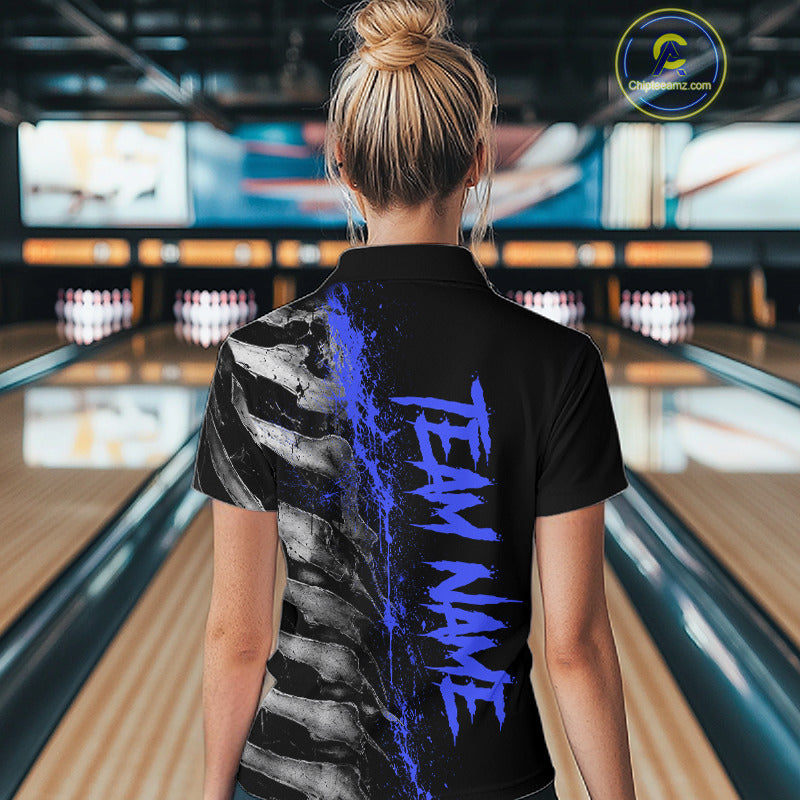 Female model wearing Blue Splatter Grey Bone bowling polo shirt during bowling league competition, skeleton artwork, precision, confidence, athletic lifestyle