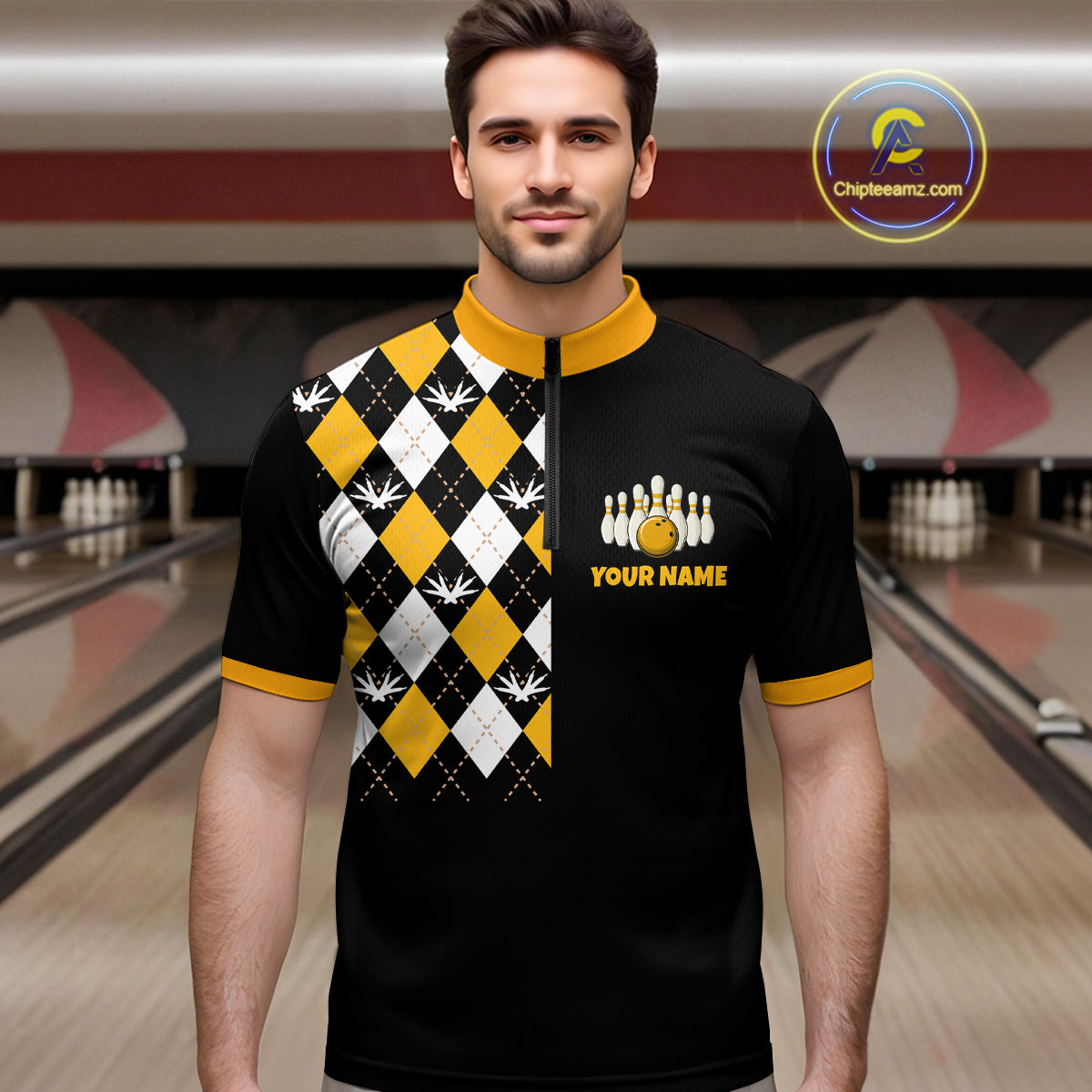 Man wearing a black and yellow bowling shirt with a pattern and logo in a bowling alley.