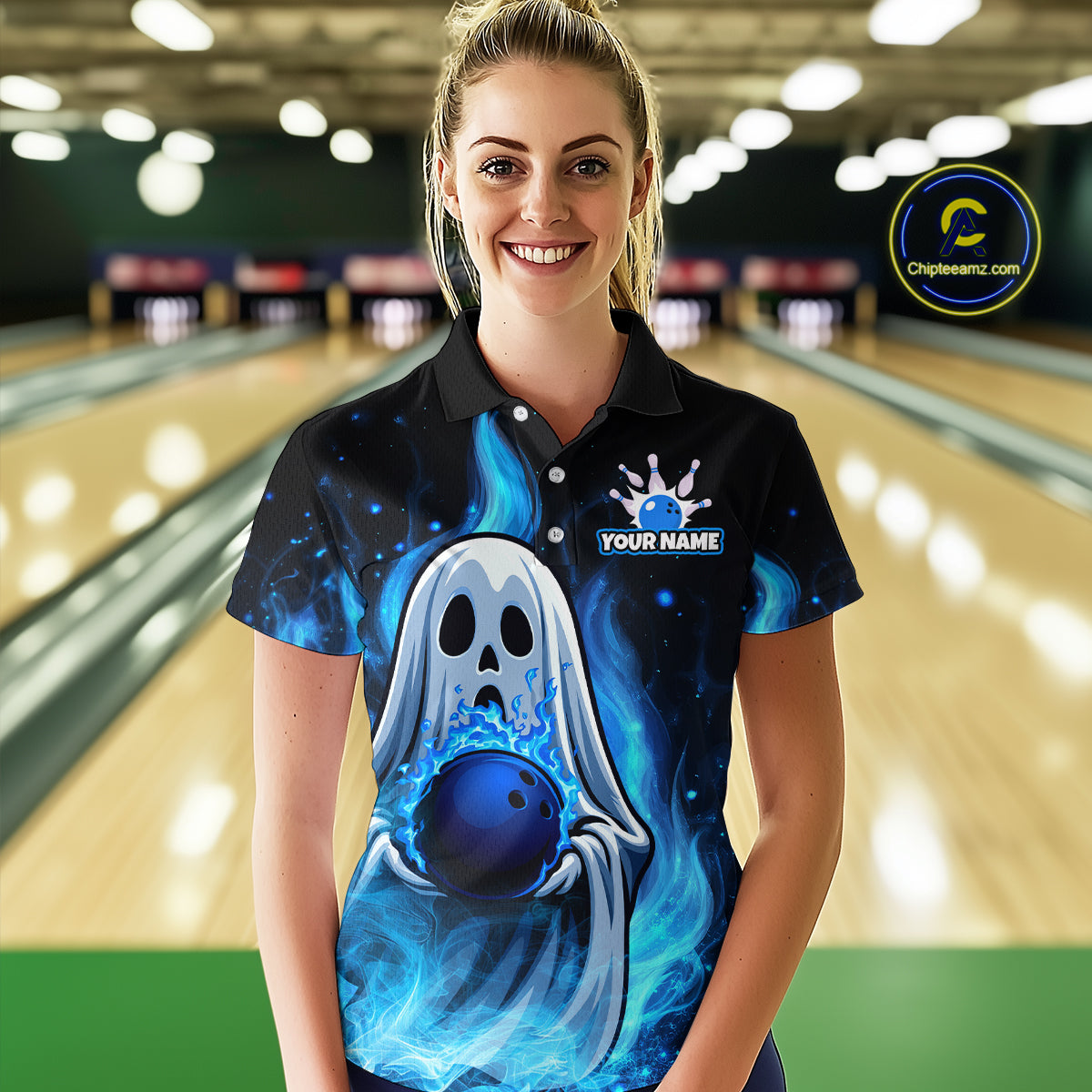Person wearing a bowling shirt with a ghost and bowling ball design in a bowling alley.