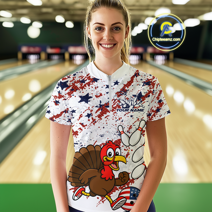 Woman wearing a colorful bowling shirt with a turkey design in a bowling alley.